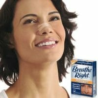 Woman wearing Breath right with packaging next to her