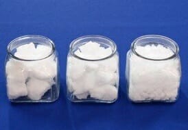 Three containers, each containing an different size foam filler